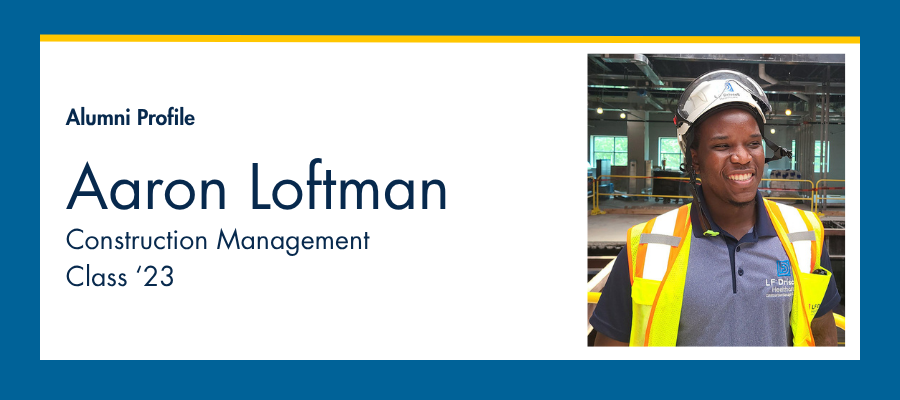 man in construction helmet and vest smiling